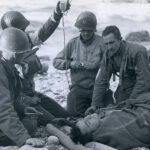 American doctors tending to a soldier. Courtesy of the National Archives