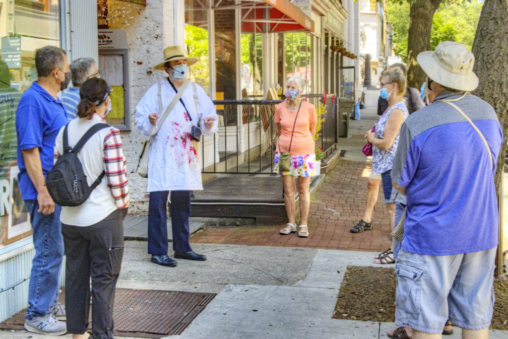 Docent Brad Stone giving a tour in July 2020 with masks on. Photo courtesy of Don Burgess