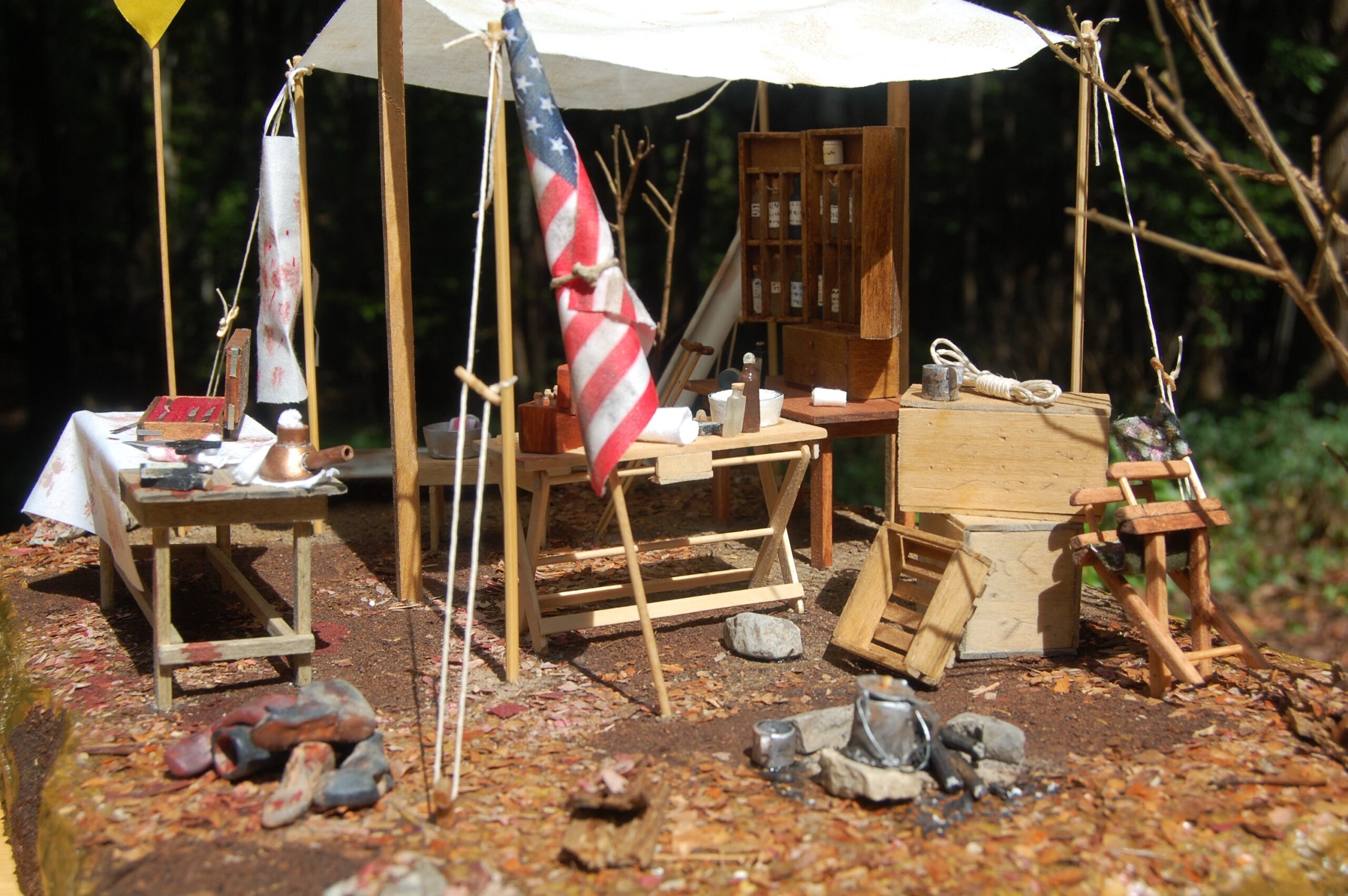 A diorama showing a tent, surgeon's table, and various medical tools